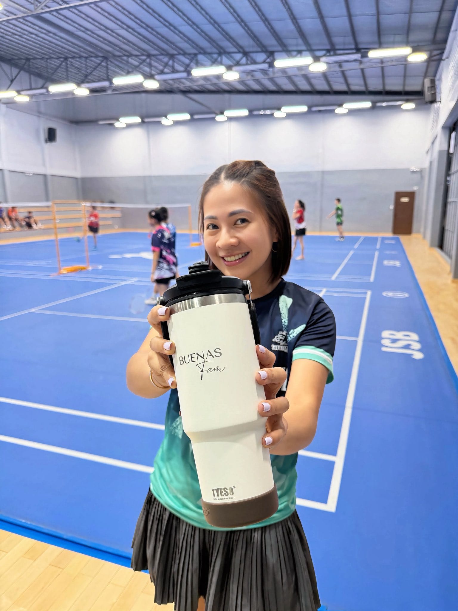 Buenas Fam branded tumbler closeup